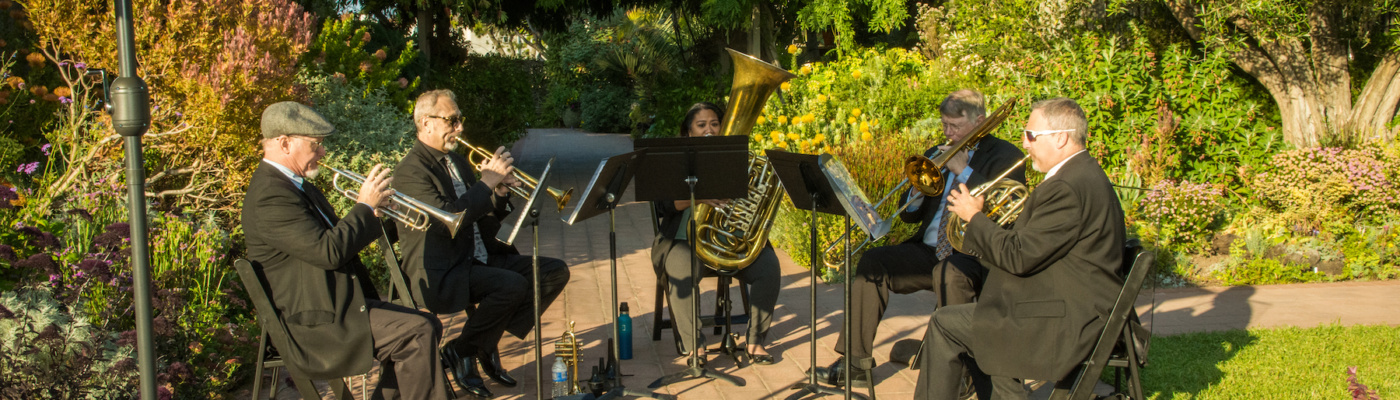 South Coast Brass in Sherman Gardens during golden hour. Photo: Jeanine Hill, 2023