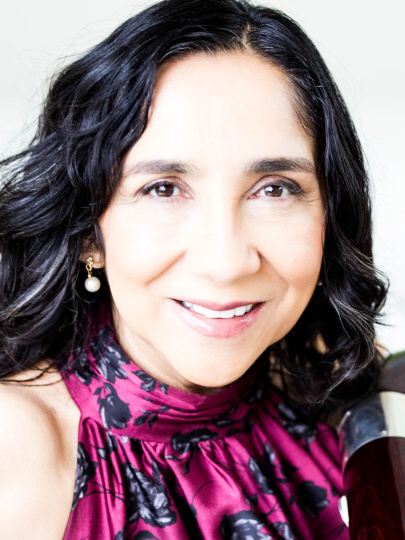 Leyla Zamora bassoonist headshot featuring contrabassoon.